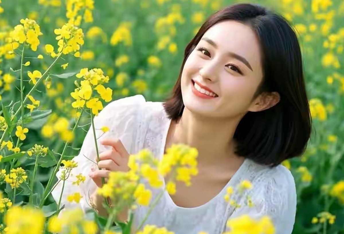 油菜花香映美女