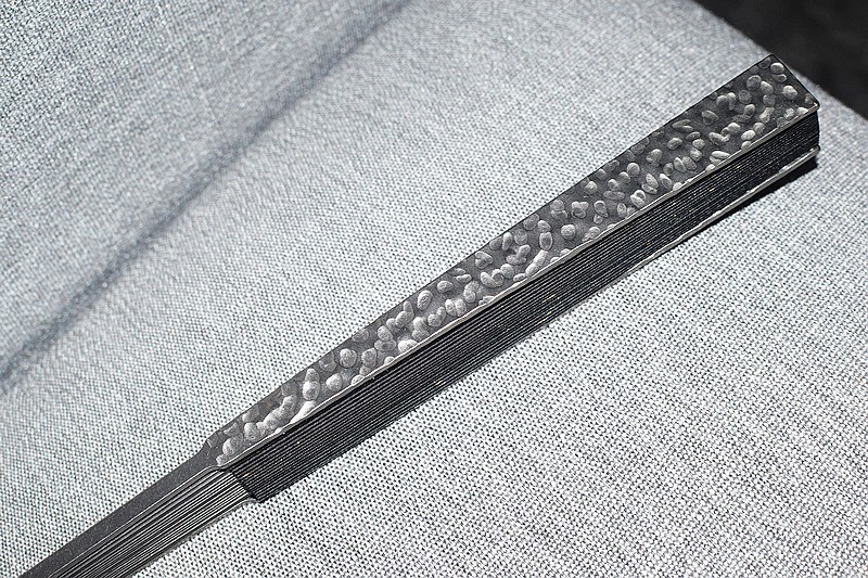 工匠精神.铮铮钛骨 费戈陨石坑马牙钛扇